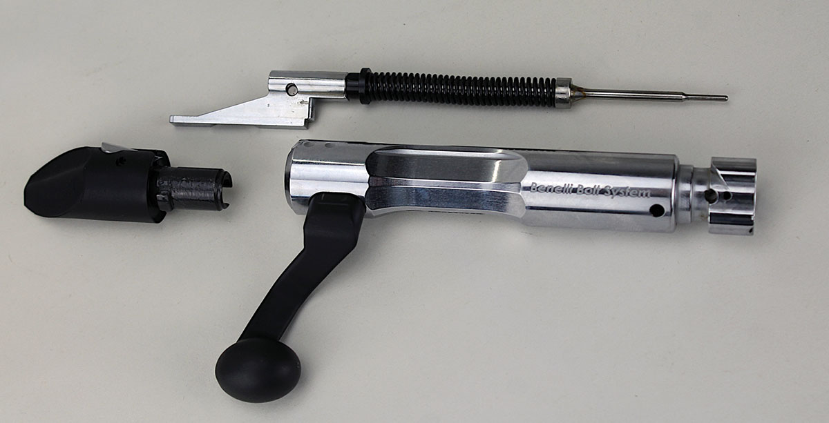 Toolless disassembly of the bolt is accomplished by simply twisting off the black polymer bolt cap (left).